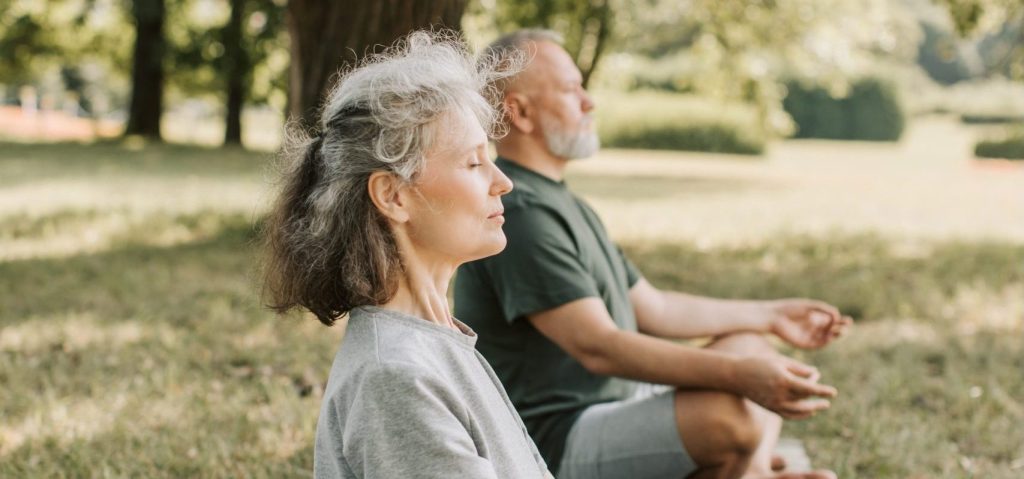 aged,man,and,woman,practicing,yoga