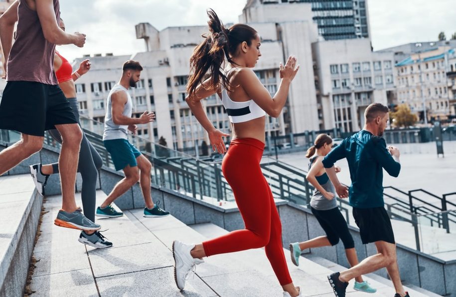 Group,Of,Young,People,In,Sports,Clothing,Jogging,While,Exercising