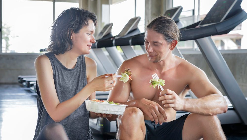 Caucasian,Couple,Sporty,Enjoy,To,Eating,Salad,Box,After,Workout,Fitness Performance,Diet,Nutrition