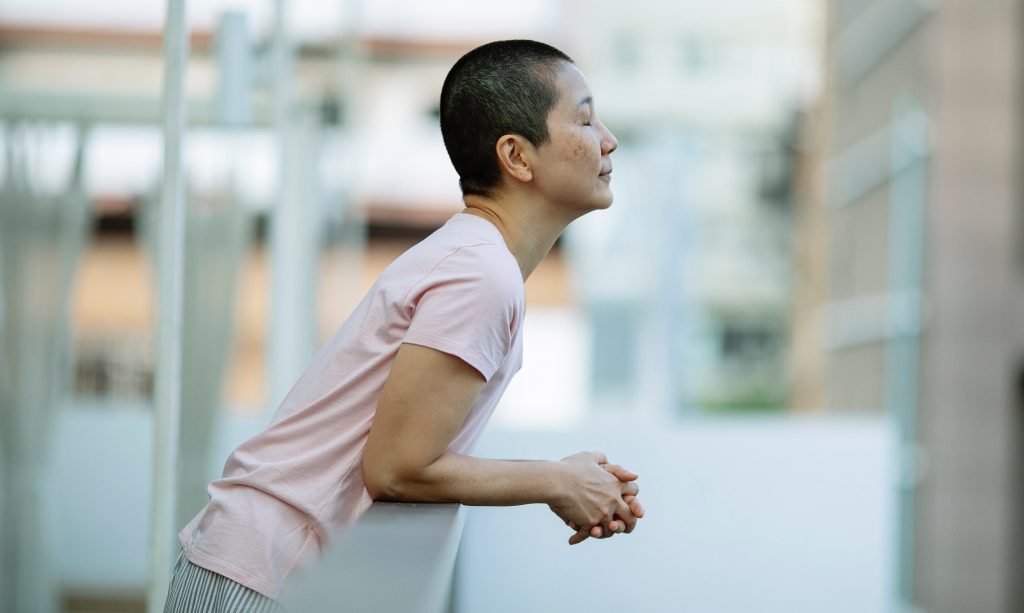 woman breathing through nose, street