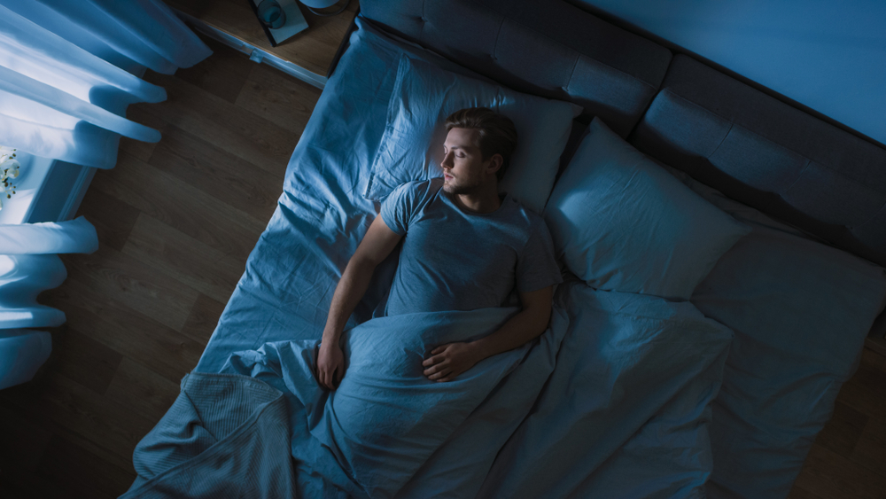 Top,View,Of,Handsome,Young,Man,Sleeping,Cozily,On,Longevity