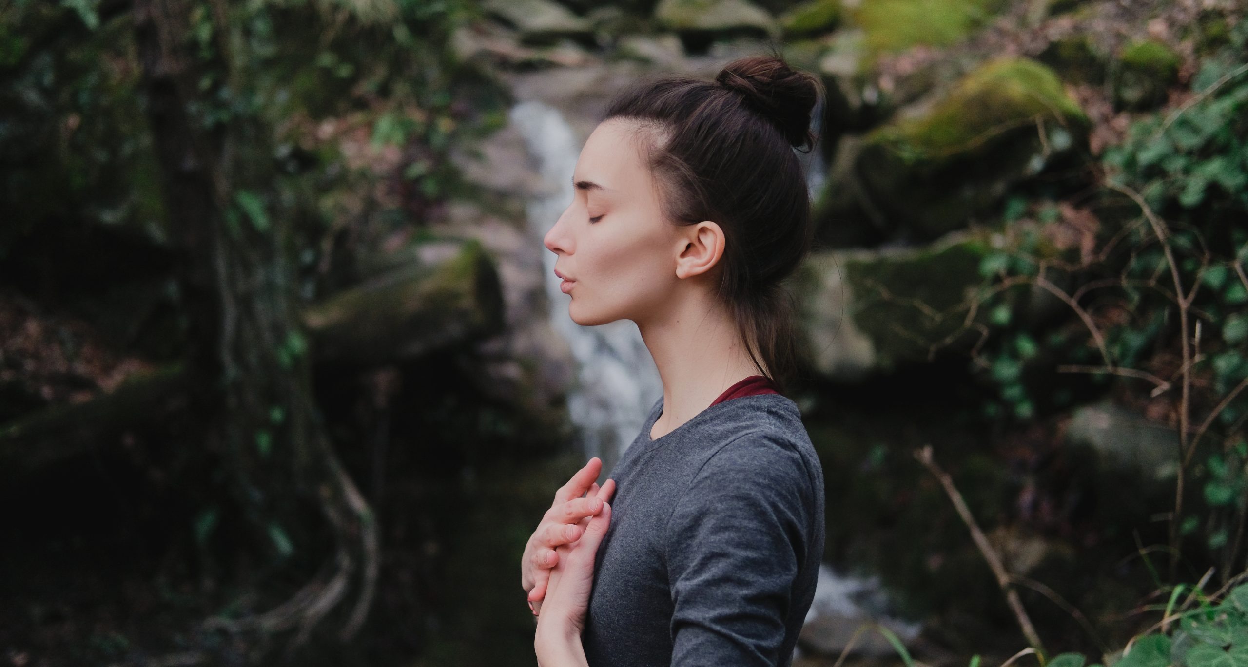 Young,Woman,Practicing,Breathing,Yoga,Pranayama,Outdoors,In,Moss,Forest