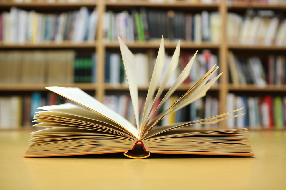 Open,Book,On,The,Table,In,Library