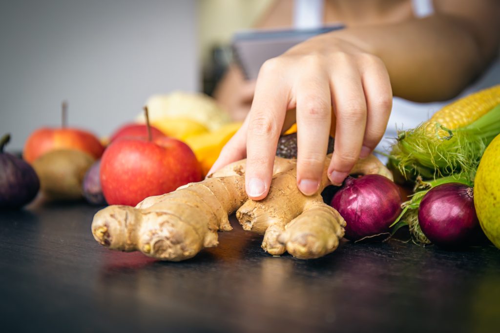 Close-up,,Ginger,Root,On,The,Kitchen,Table.