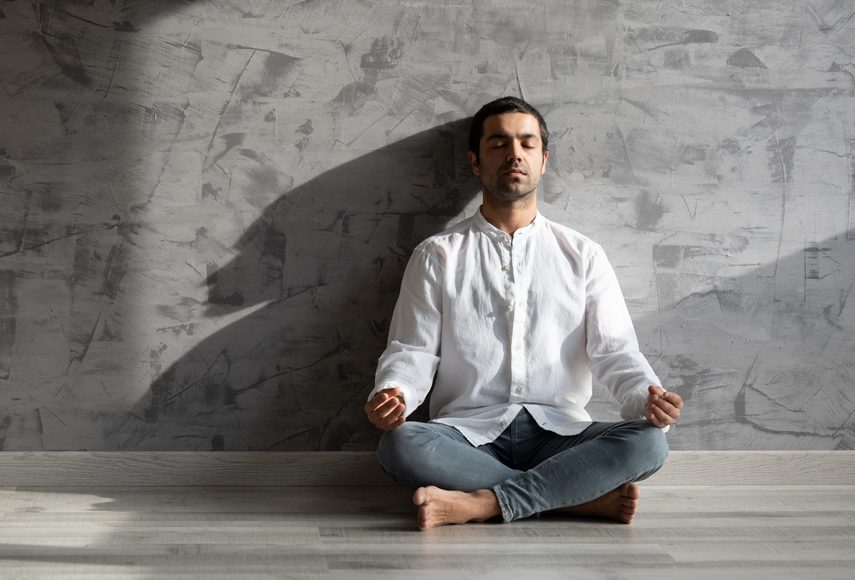 Hispanic,Young,Man,Meditating,In,Lotus,Pose,In,Sunset,Or