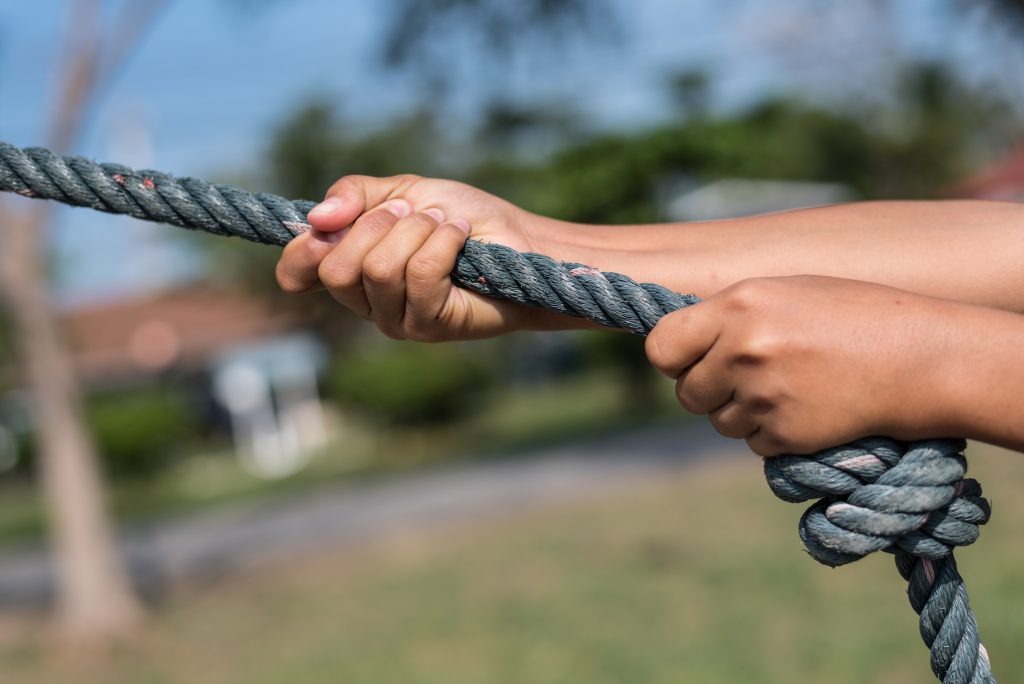 Children,Hands,Catching,The,Rope,With,Sunny,Day.