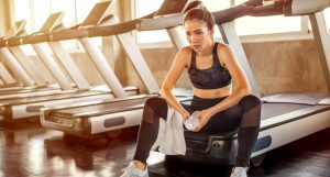 Beautiful,Asian,Young,Woman,Tired,Taking,A,Break,From,Running