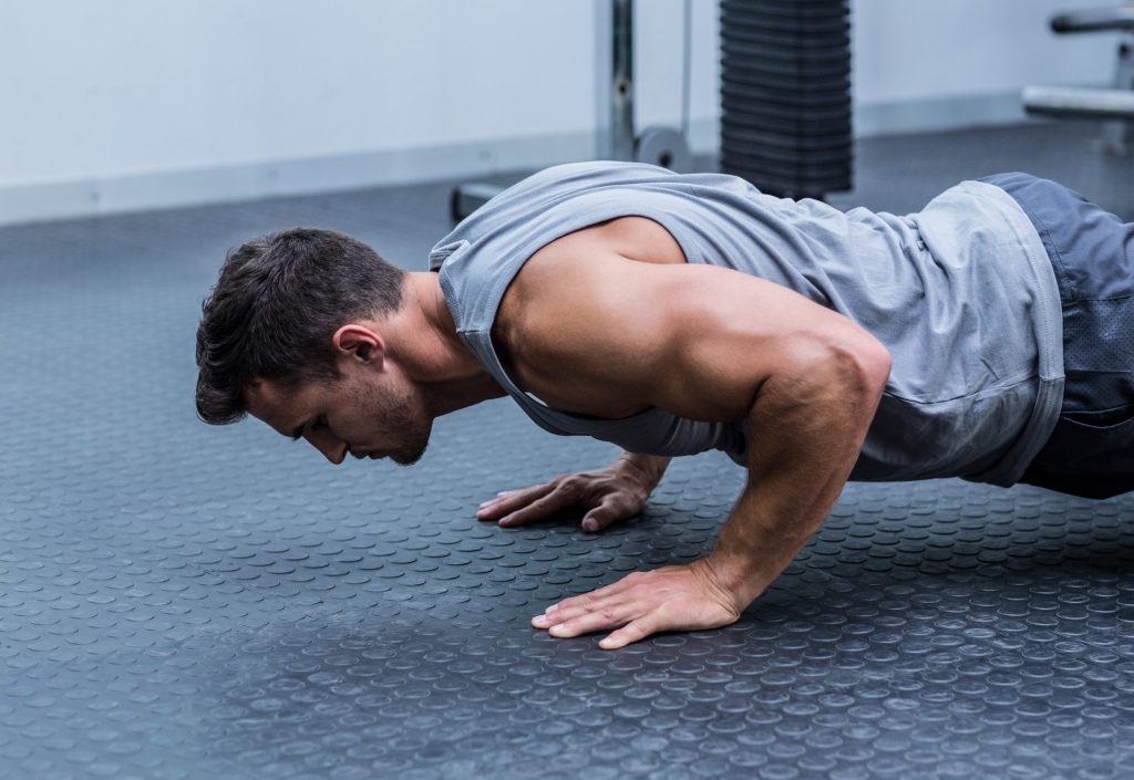 A,Muscular,Man,Doing,A,Pushups,At,The,Crossfit,Gym