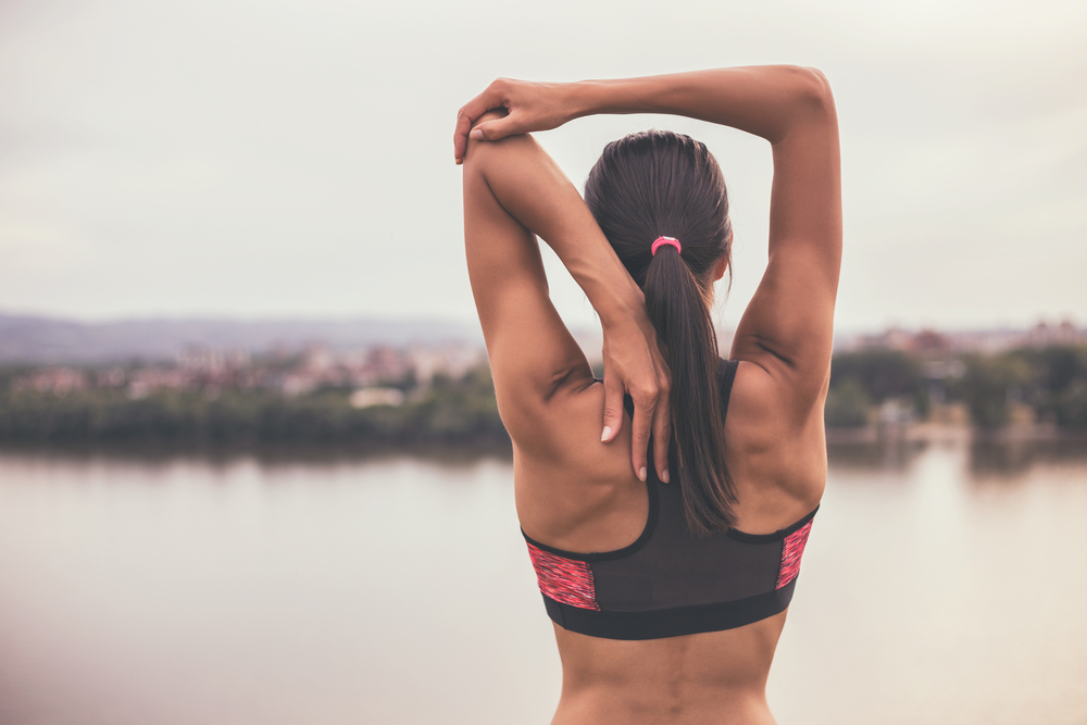 Woman,Stretching,And,Exercising,Outdoor.sporty,Girl,Exercising,Image,Is,Intentionally