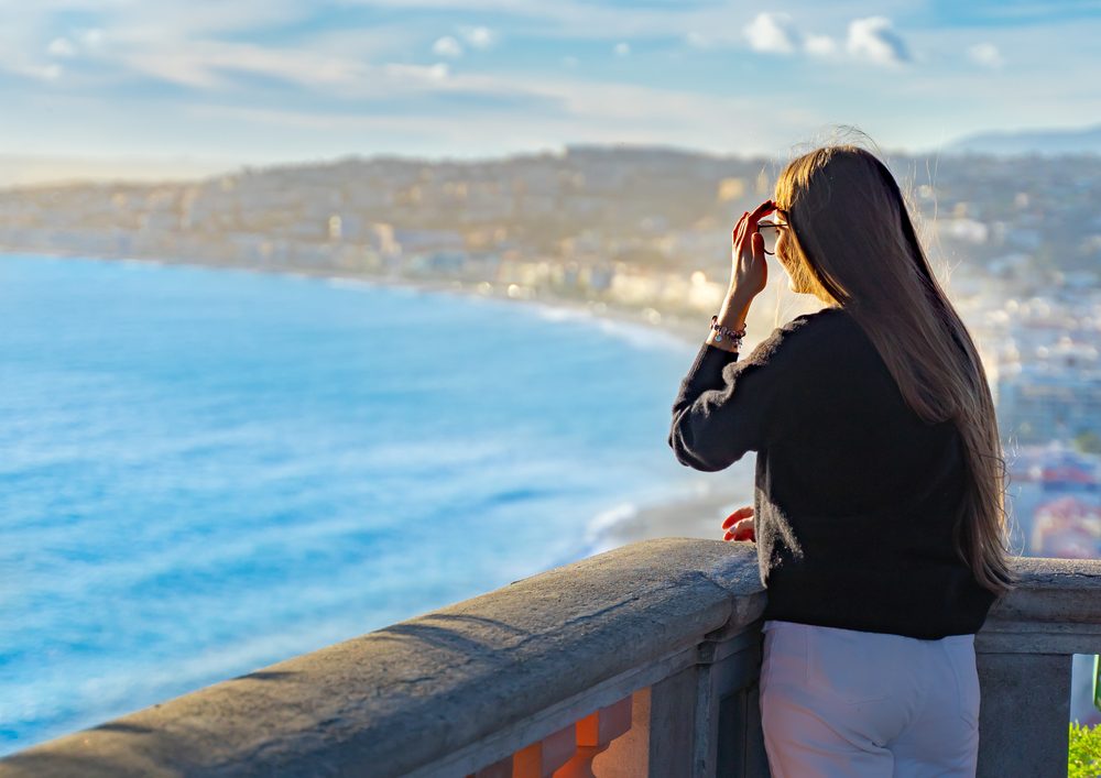 Young,Woman,Watching,Sunset,In,Nice,,France.,Beautiful,Panoramic,Aerial