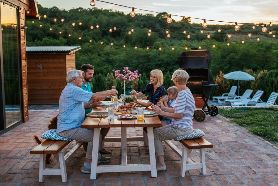 Happy,Family,Eating,Together,Outdoors.,Smiling,Generation,Family,Sitting,At