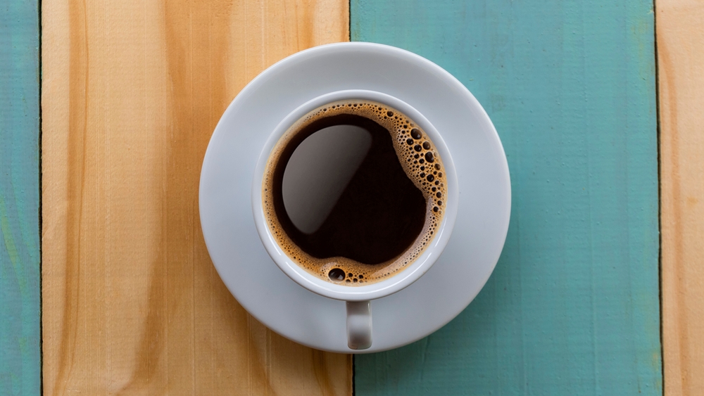 Coffee,Mug,On,Wooden,Table.,Top,View,Cup,Of,Coffee